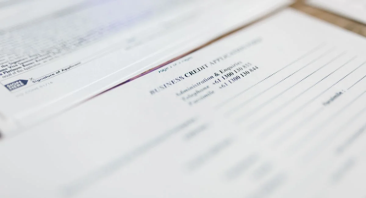 Focused image of business credit application papers, ideal for finance themes.
